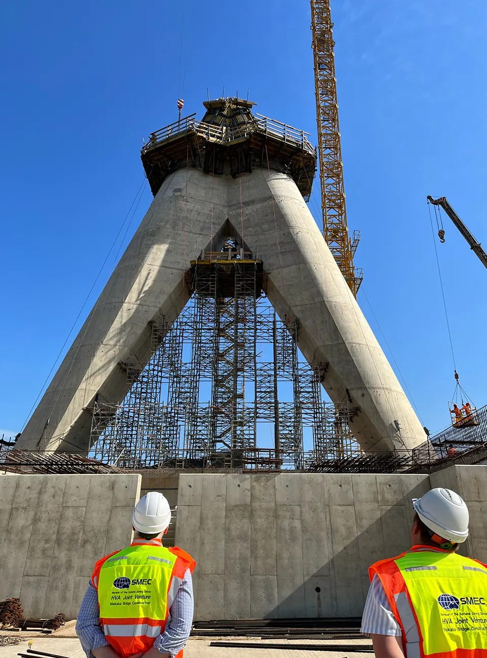 Workers looking at bridge construction